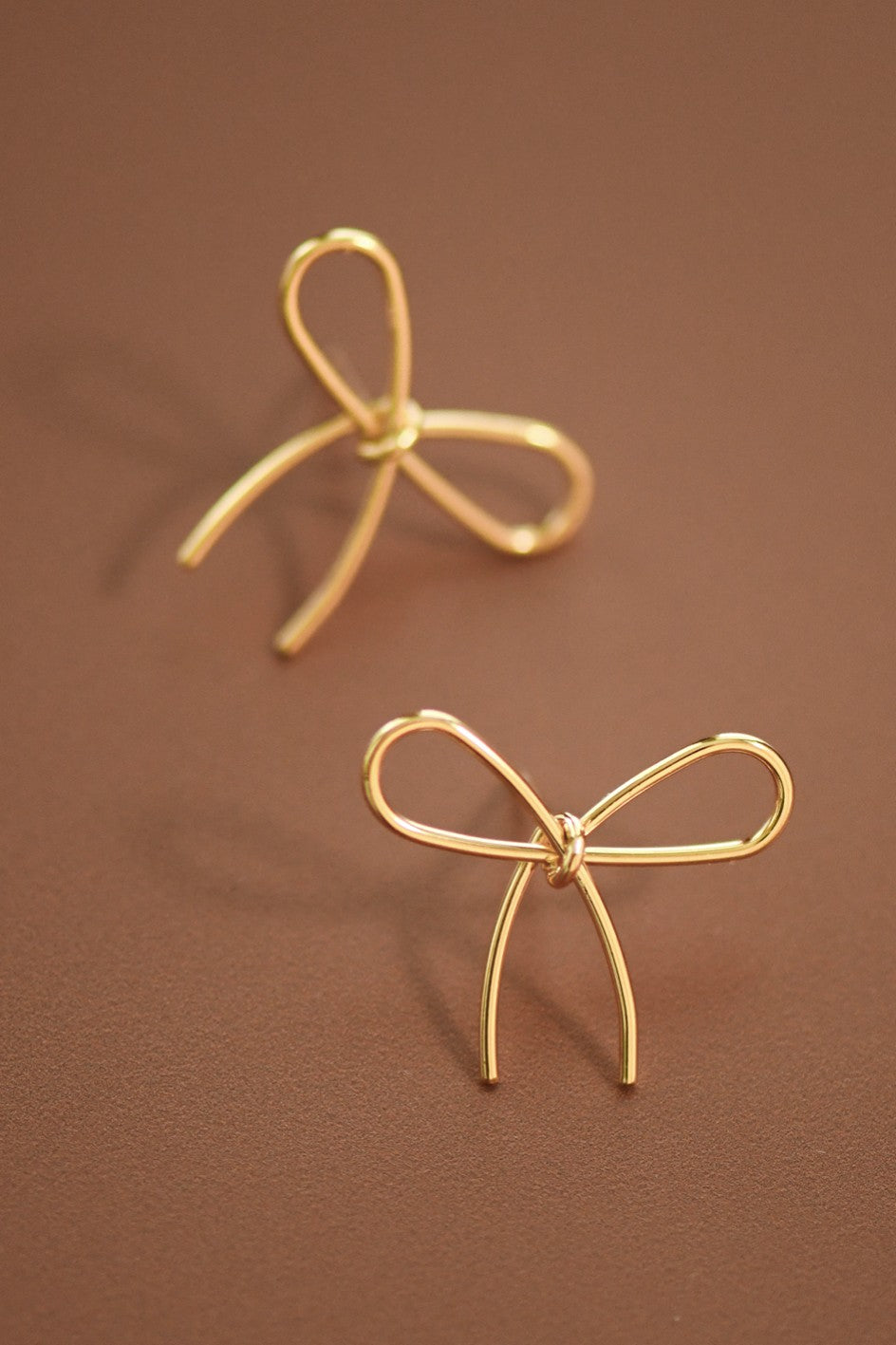 Gold Bow Knot Stud Earrings with Smooth Finish